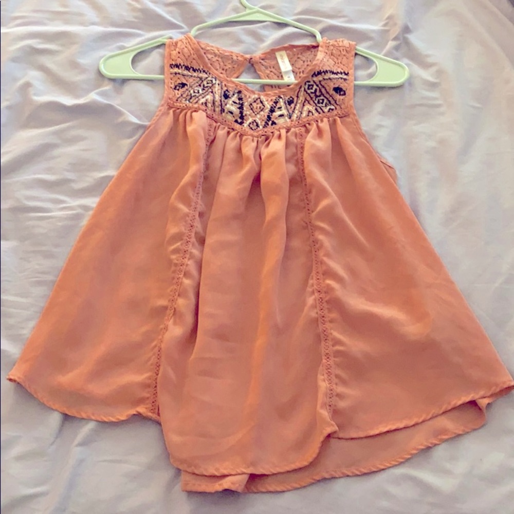 Light pink sleeveless blouse